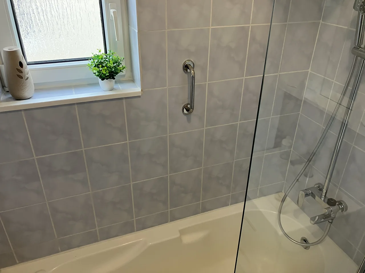 Bathroom with a bathtub and shower